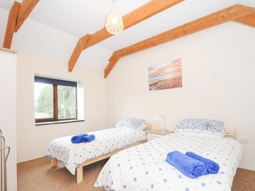 Voodi või voodid majutusasutuse The Dairy Barn toas