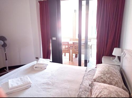 Postel nebo postele na pokoji v ubytování Residence Villa Viola fronte lago