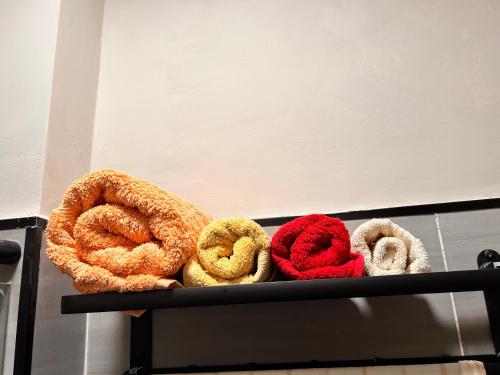 a bunch of different types of pretzels on a shelf at Mimah's cozy getaway near JKIA at Taurus Residences in Nairobi