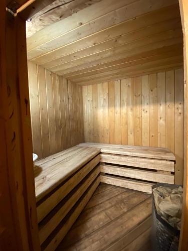 a small wooden sauna with a wooden floor at Elen in Goliševa