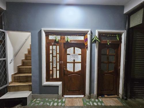 two front doors of a house with stairs at Luxmi Cozy Rentals in Haputale