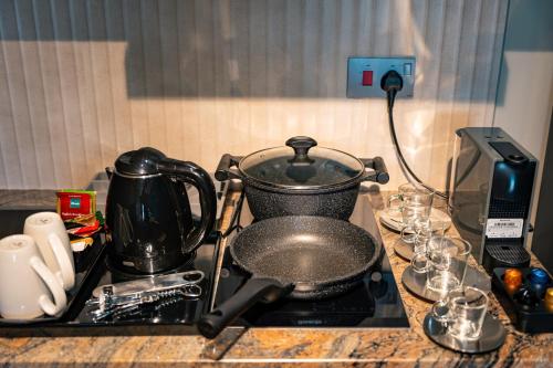a pot on top of a stove in a kitchen at Thalassa Seychelles in Beau Vallon
