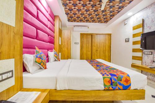 Postel nebo postele na pokoji v ubytování FabHotel Signor