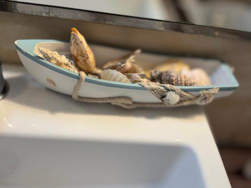 a bowl of nuts sitting on a table at Suite Elisir Egitto Domina Coral Bay Resort in Sharm El Sheikh