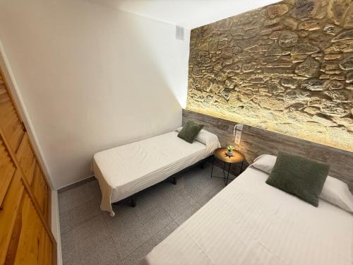 Ένα ή περισσότερα κρεβάτια σε δωμάτιο στο Agi Pi Sunyer Apartments