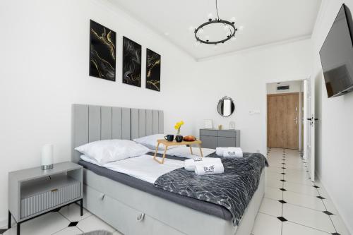Ένα ή περισσότερα κρεβάτια σε δωμάτιο στο Luxury Apartment 22 basen i sauna D&D Apartments