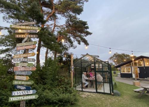 a sign with signs in front of a gazebo at Camp Hverringe in Dalby