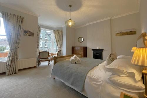 a bedroom with a bed and a fireplace at 45 Eskin Street in Keswick