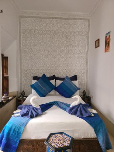 Postel nebo postele na pokoji v ubytování Riad Parfum d'Orient