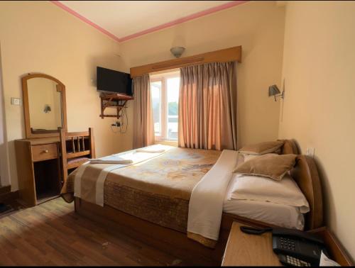 Postelja oz. postelje v sobi nastanitve Green Tara Hotel
