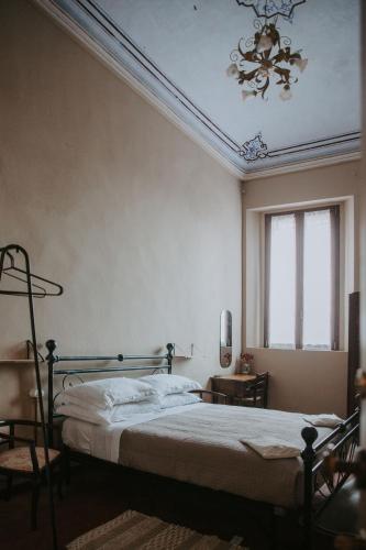 Postel nebo postele na pokoji v ubytování Agriturismo Pizzavacca