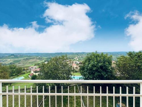 a view from the balcony of a house with a white fence at Casa Paolina in Agliano Terme