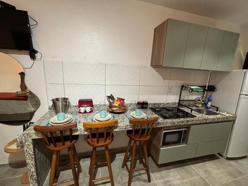 Dapur atau dapur kecil di Lugar de paz loft beira mar