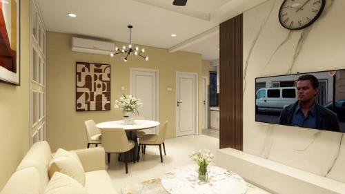 a living room with a tv on a wall at Puteri Residence in Kuala Terengganu