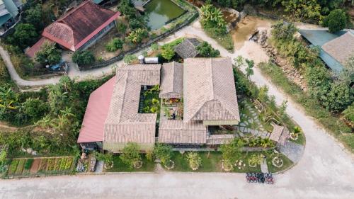 an overhead view of a house with a roof at Anans Home Ha Giang - Tours & Motorbike Rental in Ha Giang