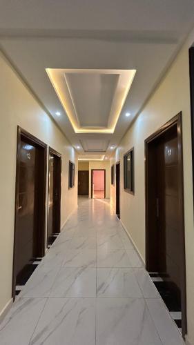 an empty hallway in a building with a ceiling at hotel diamond قصر الألماسة in Tan-Tan
