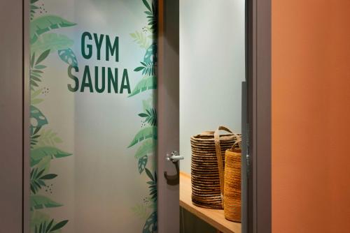 a door with a sign that reads gym sauna at Best Western Plus Hotel Noble House in Malmö