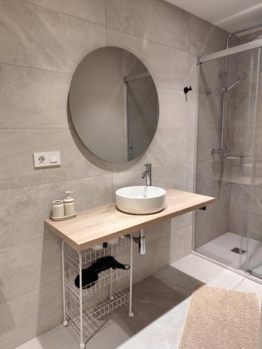 a bathroom with a sink and a mirror at Bazan51 1 in Alicante