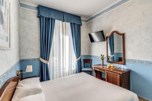 Postel nebo postele na pokoji v ubytování Hotel Orazia