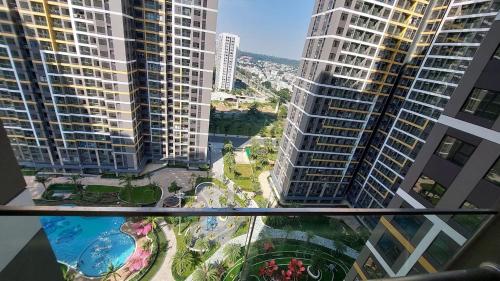 a view from the balcony of a building with tall buildings at Y Vi Vinhomes Grand Park in Long Bình