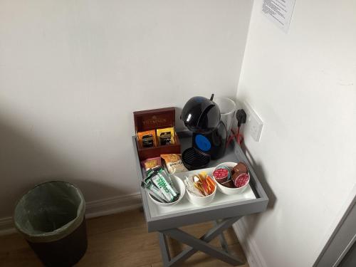 a small table with food on it next to a wall at Scalpay@Knock View Apartments, Sleat, Isle of Skye in Teangue