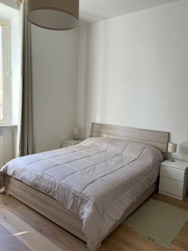 Postel nebo postele na pokoji v ubytování Morroni Apartment