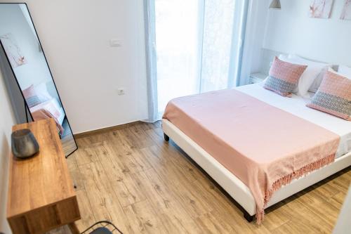 Postel nebo postele na pokoji v ubytování Pebble Garden