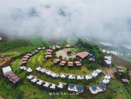 an aerial view of a resort in the clouds at Mon Sai Lom ม่อนสายลม ม่อนแจ่ม in Mon Jam