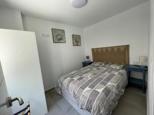 Postel nebo postele na pokoji v ubytování Mirador Playa Ribeira 1ª Línea