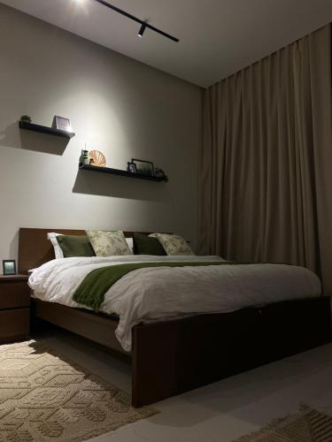 a bedroom with a large bed in a room at استوديو بمدخل خاص حي النرجس in Riyadh