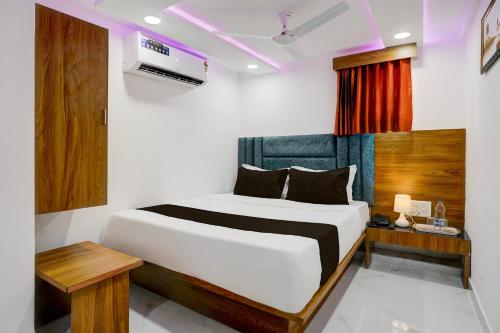 Ένα ή περισσότερα κρεβάτια σε δωμάτιο στο Super Hotel O Rion Inn