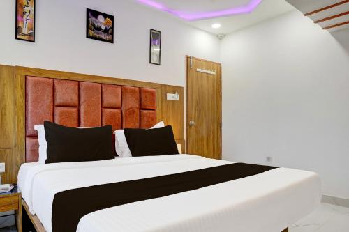 Ένα ή περισσότερα κρεβάτια σε δωμάτιο στο Super Hotel O Rion Inn