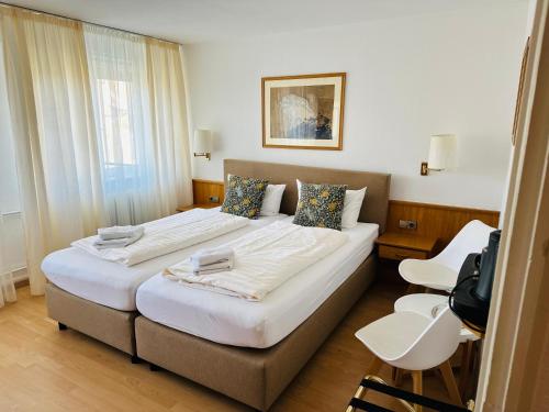 Postel nebo postele na pokoji v ubytování Hotel Hofmann Zur Mühle
