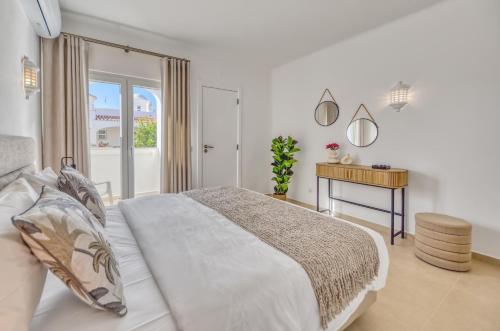 Ένα ή περισσότερα κρεβάτια σε δωμάτιο στο Casa Amira