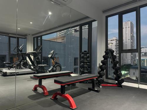 a gym with a bike and a bench in a room at 6th Avenue Sukhumvit BKK 407 BTS Asoke Nana in Bangkok