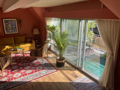 a living room with a large sliding glass door at Big apartment by the Farmers market in Kitchener