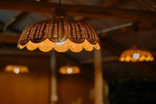 a close up of aendant light hanging from a ceiling at Charm Vân Long in Ninh Binh