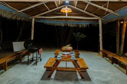 a set of tables in a tent with a table sidx sidx sidx at Charm Vân Long in Ninh Binh