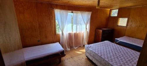 Postel nebo postele na pokoji v ubytování Cómoda cabaña rodeada de naturaleza