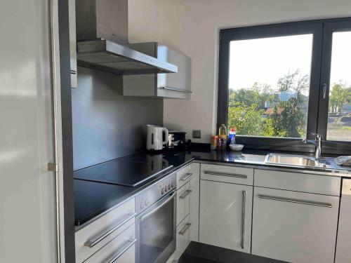 Kuchyň nebo kuchyňský kout v ubytování Sonnendurchflutetes Penthouse