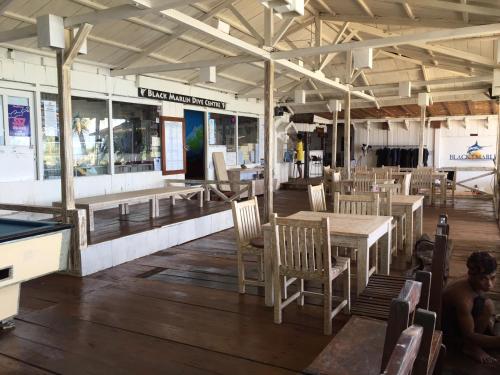 A restaurant or other place to eat at Black Marlin - Kadidiri