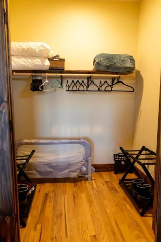 a room with two bunk beds and a wooden floor at Bear Paw Lodge - North Carolina in Boomer