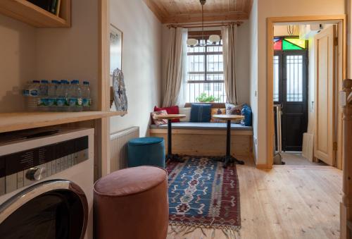 a living room with a couch and a window at Applehill in Istanbul