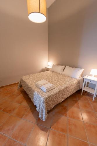 a bedroom with a bed and a table at Artis Mare in Pozzuoli