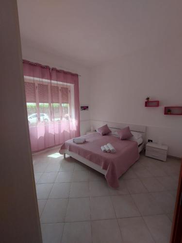 Postel nebo postele na pokoji v ubytování casa vacanze al mare