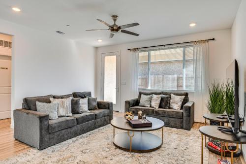 a living room with two couches and a table at 15 Mi to Dtwn Sacramento Newly Built Home! in Sacramento