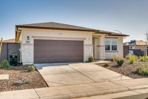 a house with a garage and a driveway at 15 Mi to Dtwn Sacramento Newly Built Home! in Sacramento