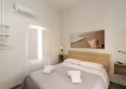 Postel nebo postele na pokoji v ubytování Mariù Loft & Apartments