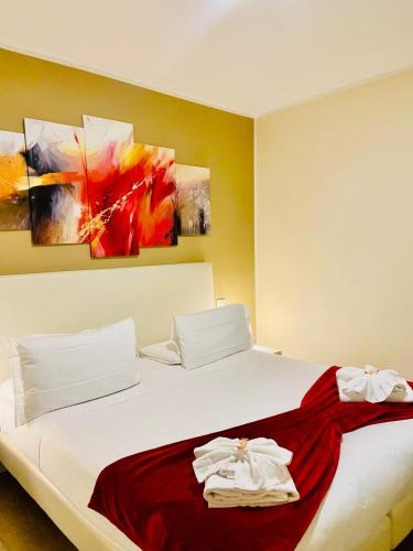 a bedroom with a bed with two towels on it at Verona Enjoy in Verona