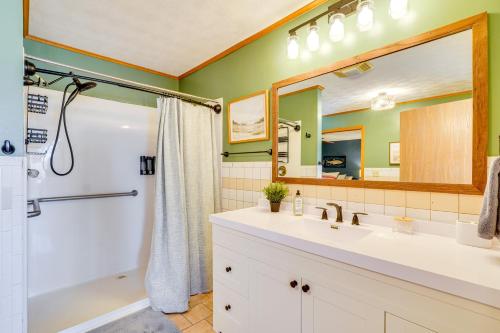 a bathroom with a white sink and a shower at Deck and Lake Views Modern Eagle Rock Gem in Eagle Rock